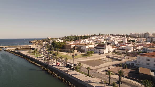 Aerial slide overlook Lagos Promenade along Descobrimentos Avenue, Algarve alt