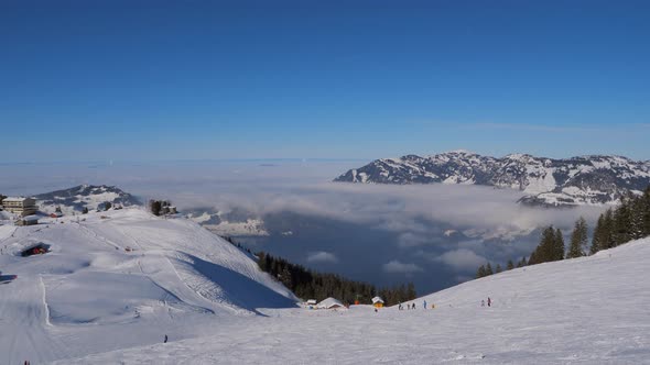 ski area in the Swiss alps with people and chairlifts in the winter ski area of ​​Beckenried alt
