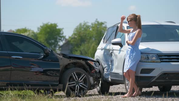 Sad Female Driver Speaking on Sellphone on Street Side Calling for Emergency Service After Car alt