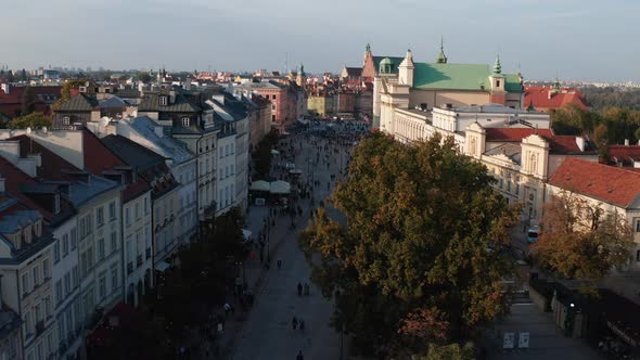 Forwards Fly Above Tourists Walking and Sightseeing on Krakowskie in Historic City Centre alt