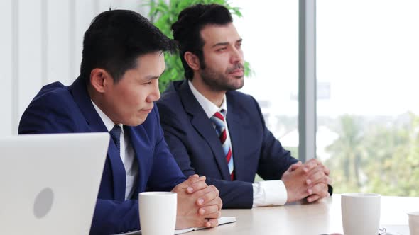 Multiethnic business team discussing development ideas with shareholders brainstorming alt