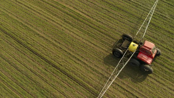 Aerial: Self-propelled Sprayer Treats Winter Crops with Chemicals in the Spring alt