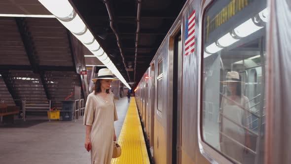 Young passenger entering a subway car alt