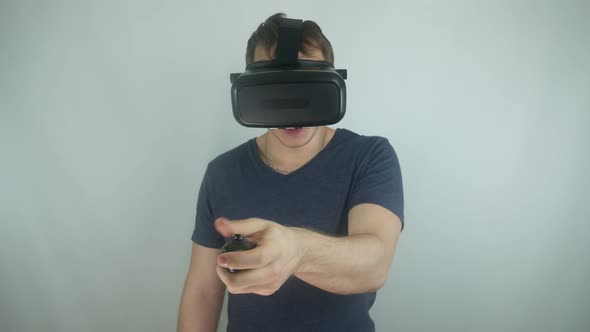 Man In A Modern Helmet Of Virtual Reality In A Simulation Game