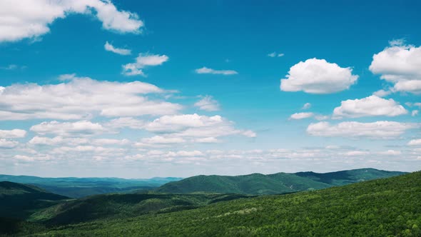 Landscape with Clouds Floating Across Sky Green Hills alt