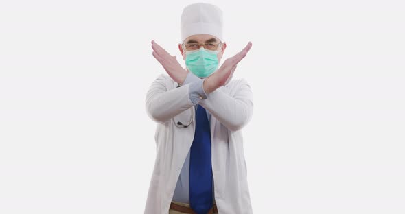 Medical Worker or Doctor Showing Stop Sign on Hospital. Isolated on White. alt