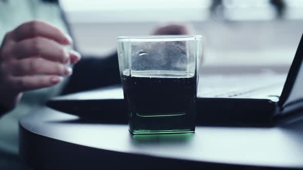 Close Up of a Woman Drinking Soda and Working on Laptop at Home Close Up Freelance Cinematic Shot