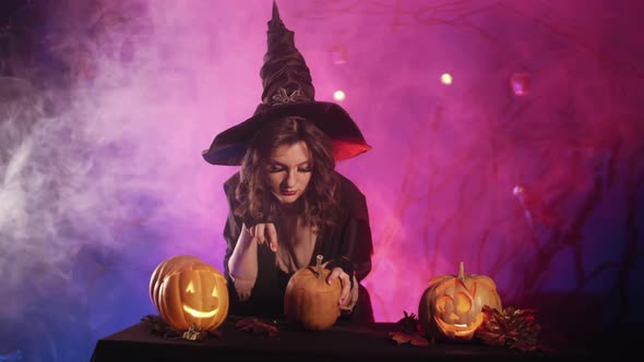 Beautiful witch lights pumpkin for halloween.   Halloween! 4K. Stock video.