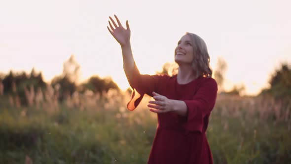 Smiling Woman Wearing Hat Looking Into Camera alt