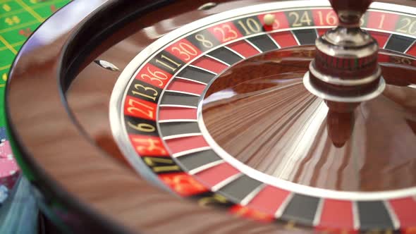 The Small Ball Falls Into the Slot As the Roulette Wheel Spins