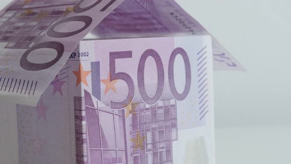 Slow tilt on real estate metaphor with 500 Euros 4K 21650p 30fps UltraHD footage - European Union pa alt