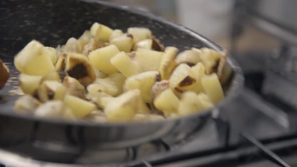 Potatoes and meat cooking slowmotion
