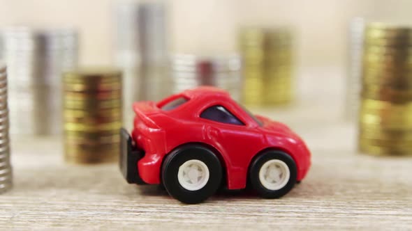 Concept Red Toy Car And Different Coins