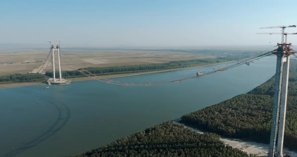 Danube River Spanned By Braila Bridge Under Construction With Towers And Main Cables In Romania. - a alt