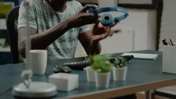 African American Man with Headphones Listening to Music alt