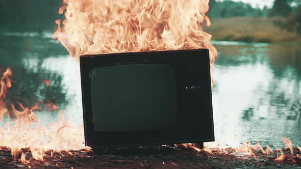 Old TV Burns with Fire