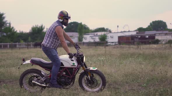 Professional Motorcyclist Drift and Turns on a Motorcycle on the Ground a Biker Does a Trick on a alt