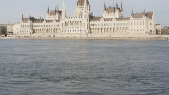 Budapestan parliament building by the day and beautiful Danube scenry 4K 2160p UltraHD tilting foota alt