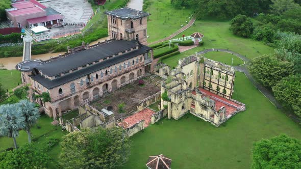 British colonial ruins, old Scottish folly, drone fly around riverside incomplete architecture struc alt