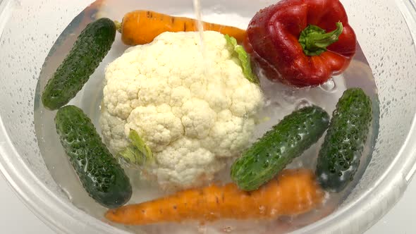 The washing  of the vegetables before eating. alt