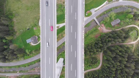 Aerial Top View of Highway Viaduct with Multilane Traffic in Mountains. Autobahn in Austria alt