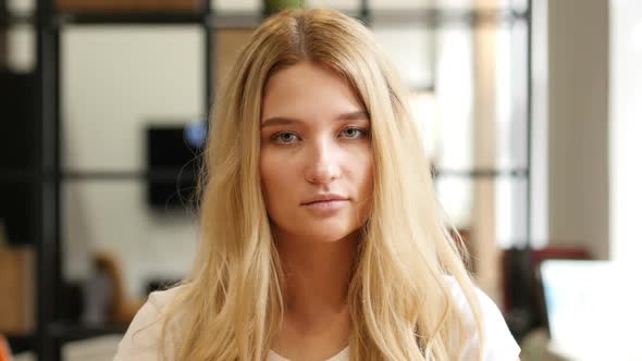 Portrait Of Beautiful Blond Girl alt