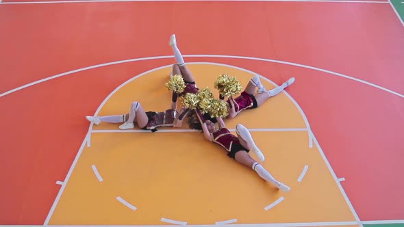 Girl Cheerleaders Performing on Floor alt