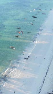Vertical Video Boats in the Ocean Near the Coast of Zanzibar Tanzania alt