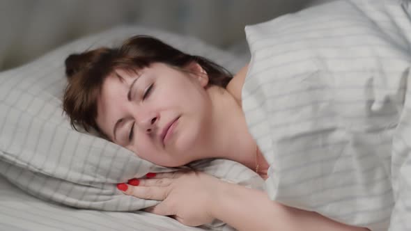 Brunette Woman Puts Her Head on a Pillow Woman Did All the Work and Go to Bed at Night Woman with