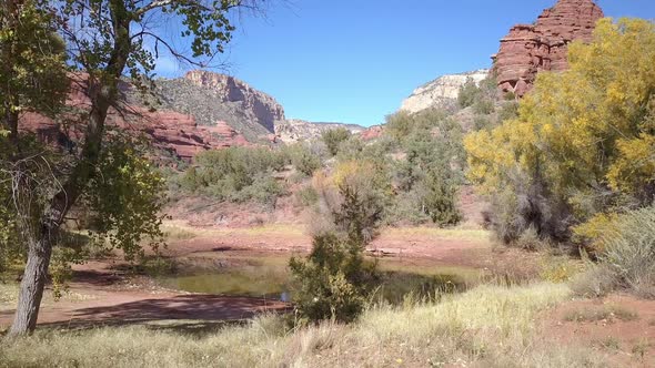 Rotating pan of stagnant pond in the desert during Fall alt