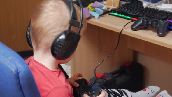 Boy Playing With Joystick alt
