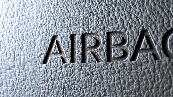 Safety airbag sign in the car's dark leather upholstery. Detailed texture. 4K HD