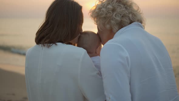 Mom and Grandmother with a Child at the Sea