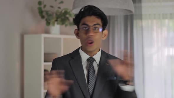 Angry Indian man says no against camera, wearing formal clothes at home, day alt