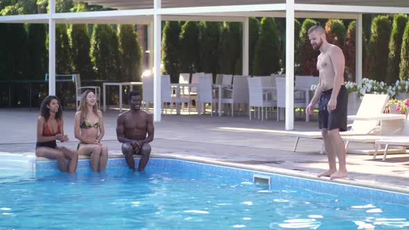 Joyful Young People Having Fun in Swimming Pool alt