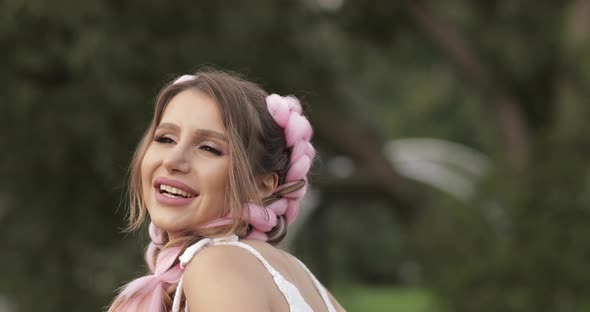 Closeup Face Beautiful Carefree Young Woman with Pink Hairstyle Making Air Kiss Looking at Camera