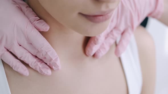 Masseur in Pink Gloves Massages Woman's Neck in Spa alt