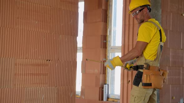 Construction Builder Worker Working Inside Newly Constructed Building alt