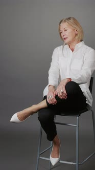 Vertical Studio Portrait of Mature Businesswoman alt