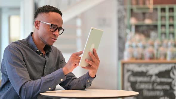 Attractive Casual Young Man Using Smartphone at Home alt