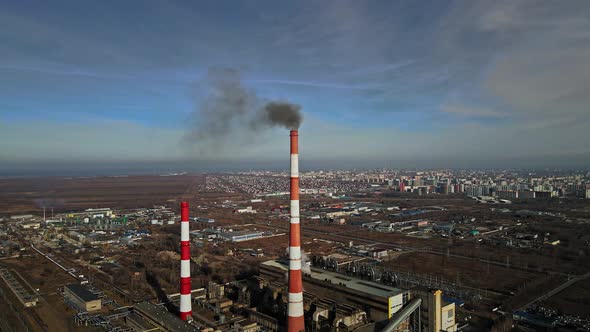 View of the City From Above Against the Background of the Pipes of the Thermal Power Plant From