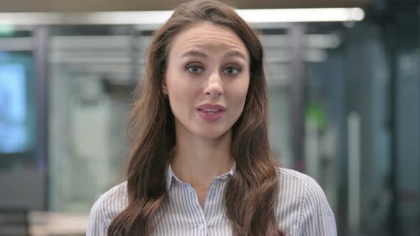 Portrait of Young Woman showing No Sign by Shaking Head alt
