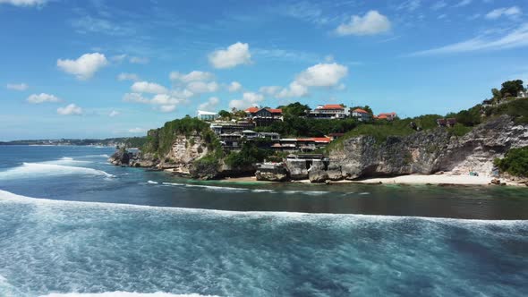 Fly along Uluwatu cliff blue ocean sky alt