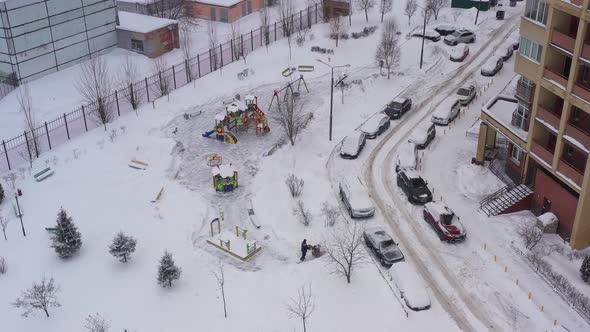 A Snow Blower Removes Snow on the Playground with the Help of Special Equipment in the Courtyard of