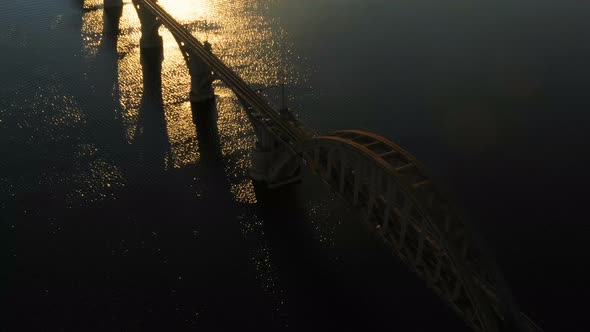 Sunset Aerial View Of Railroad Bridge alt