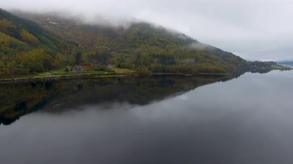 Aerial drone view of Loch Leven in Scotland on a moody misty day