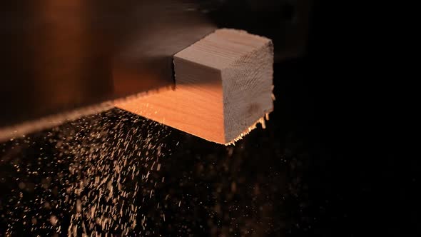 Man Carpenter Saws a Wooden Board with a Hand Saw alt