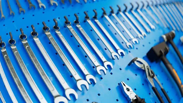 Garage tools hanging on the organizer wall. Loopable animation. Workshop. 4K HD alt