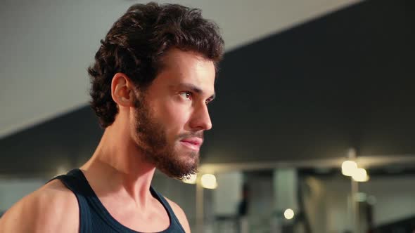 Close-up of Face of Athletic Man with Muscular Body Doing Weight Lifting. alt