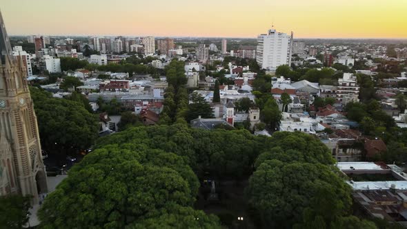 Aerial dolly out revealing San Isidro cathedral and square with some artisans at fair alt